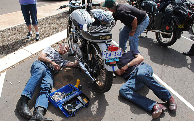 Phil, Bill and
          Warwick adjusting a primary chain on the Bonnie at Kulin.