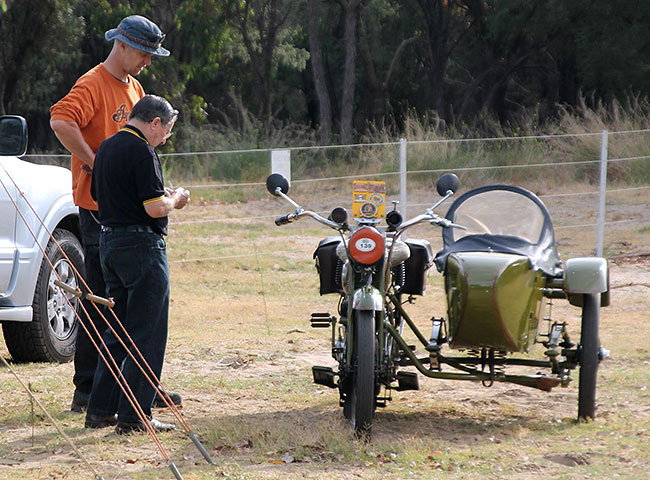 Ronnie discussing Spencer’s 1917 Harley Davidson
          outfit.