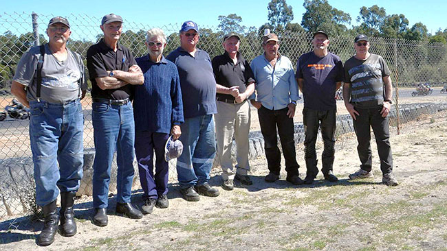 The blokes lined
          up to watch the races.