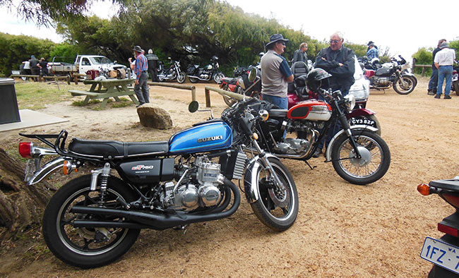 Beautifully-restored Suzuki 750 waterbottle in
          foreground.