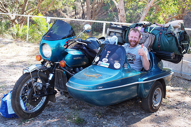 Happy charioteer in Goldwing sidecar.