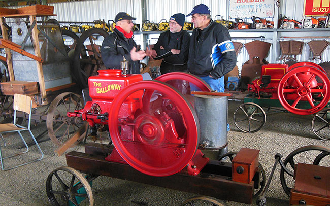 Bob, Ian and Max discussing an old motor called The
          Galloway.