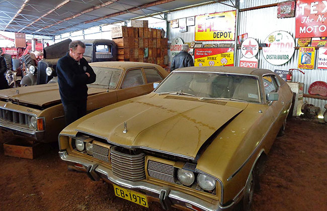 Garry Taylor eyes off one of the cars.