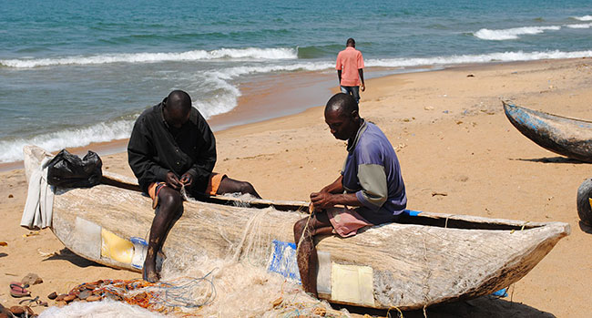 Fishermen sorting out their nets, Lake Malawi.