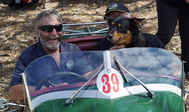 Tom and dog and friend in Triking three-wheeler.