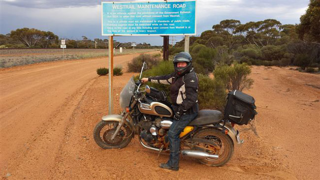 An undaunted Kylie on yet more greasy gravel.