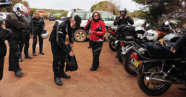 John putting on his wet weather gear to the amusement
          of the rest of us.