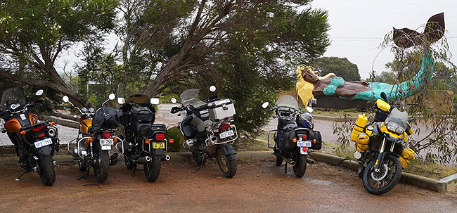 Dubious-looking mermaid keeps bike watch at Bremer
          Bay.