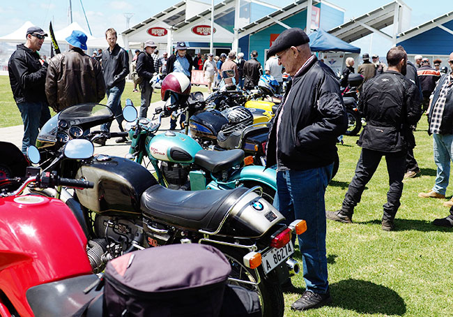 Man admiring an R90S.