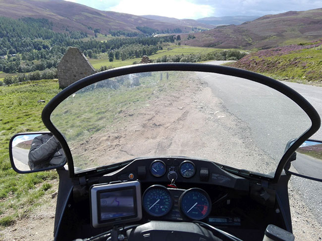 The view of the fabulous Cairngorms in the Grampian Mountains, from the bike, GPS on the handlebars.