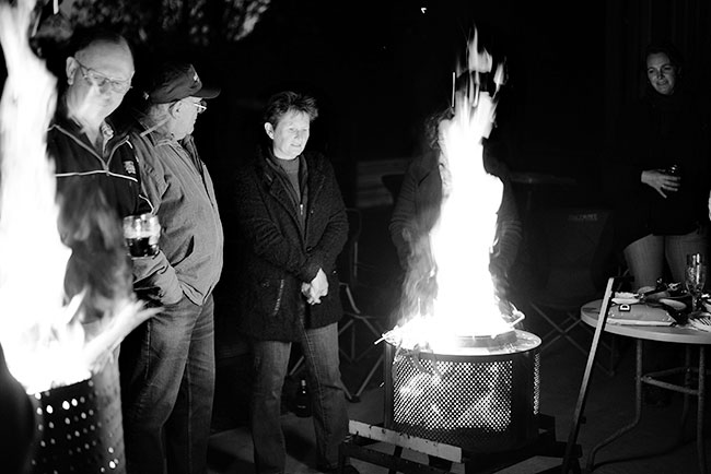 Colin, Warwick and Leanne keeping warm, while Antoinet looks on in the shadows.