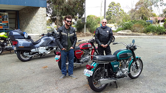 Tristan and Bob admiring the three-cylinder British bikes.