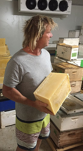 Kevin MacNeall with a block of beeswax.