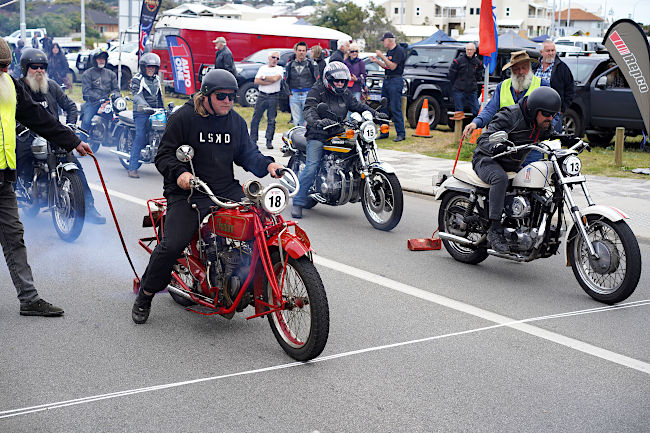  No. 18 Lachlan Matthew on his 1926 Indian Scout and No. 13 Mark Matthew on his 1979 Harley Sportster at the start line.