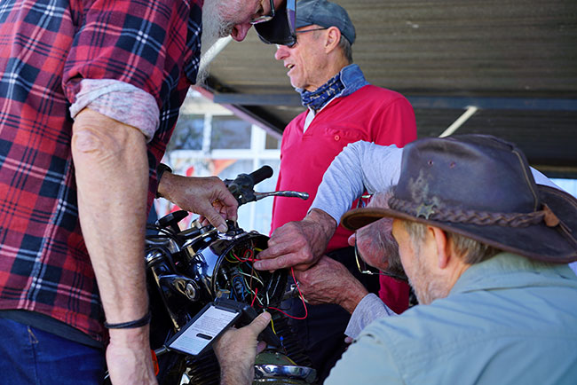 Many hands in the headlight figuring out Johns electrical problem.