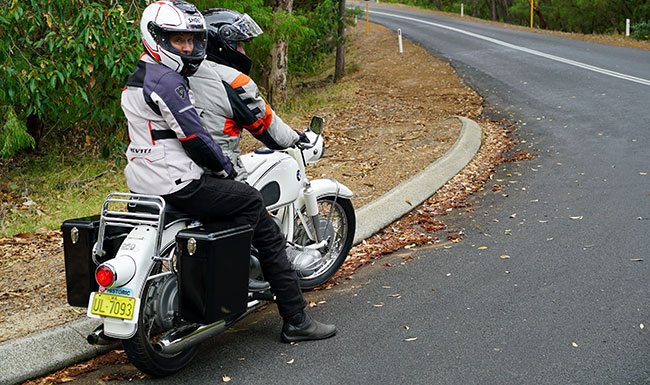 Elina having a break from riding, pillioning on Huws BMW.