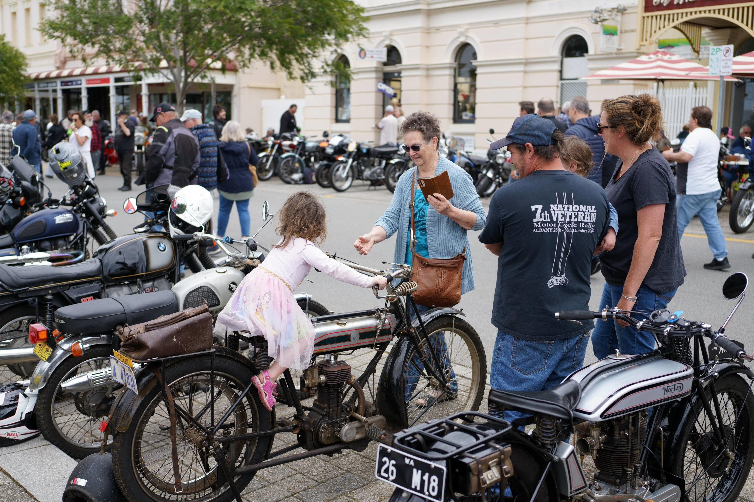 Three generations having vintage
        fun.